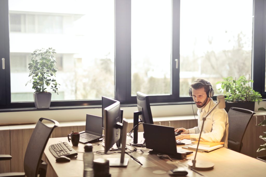 A person working with few computers